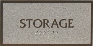 Storage sign with raised letters and braille