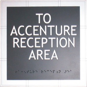 Sign reading "To Accenture Reception Area" with Braille