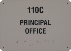 110C principal office sign with Braille