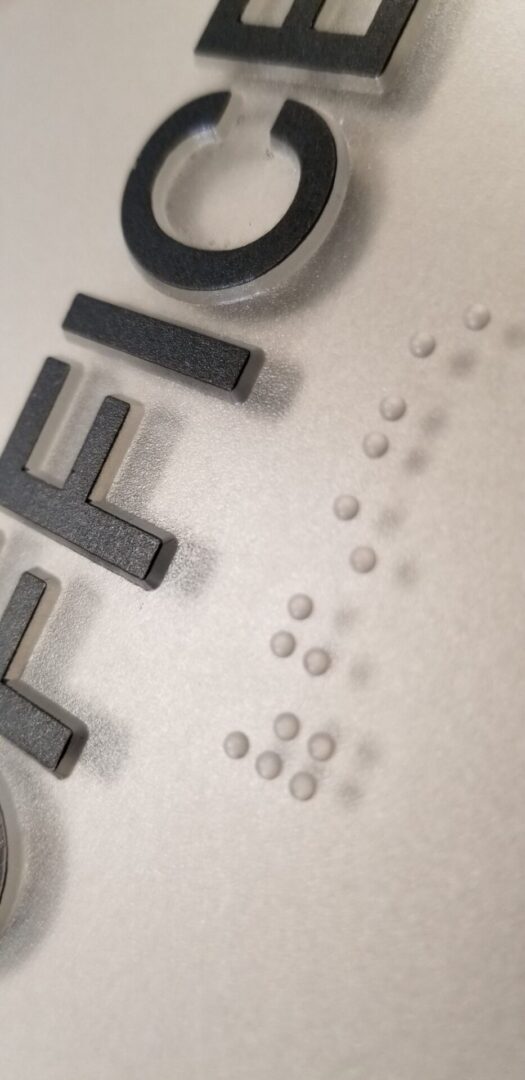 Office sign with Braille text